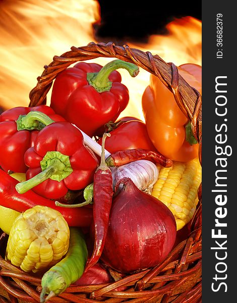 Vegetables in the basket on a background of fire XXXL. Vegetables in the basket on a background of fire XXXL