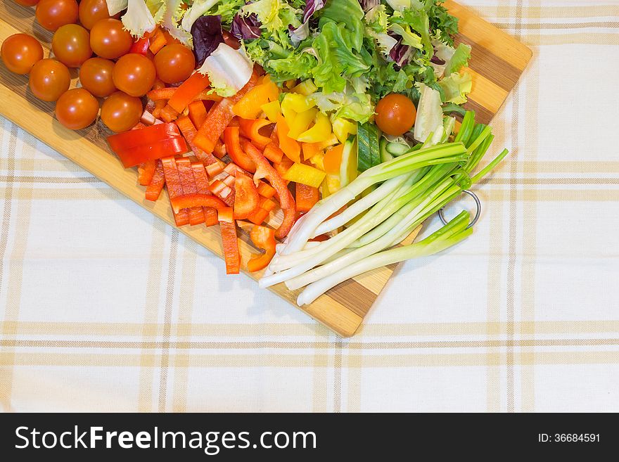 Salad on a cutting board - Vegetables border. Salad on a cutting board - Vegetables border