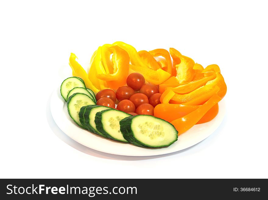 Plate with vegetables isolated on white