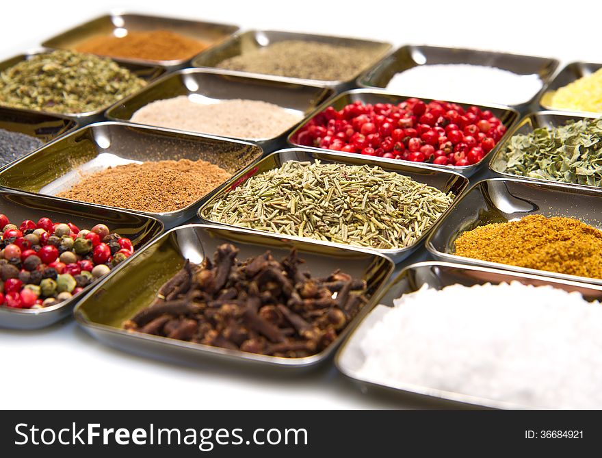 Colored and mixed spice in box on white background. Colored and mixed spice in box on white background