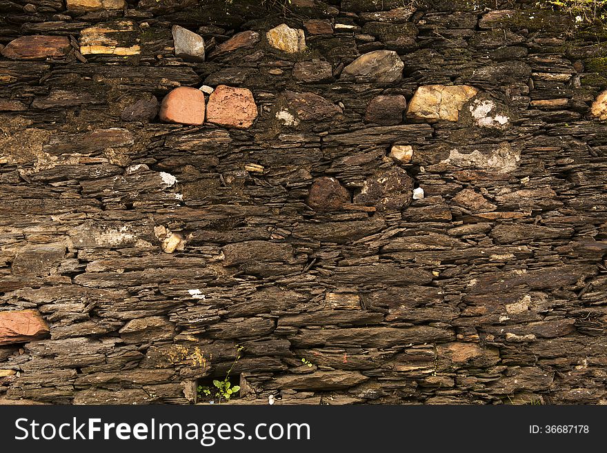 Closeup of 18th century stone wall texture in the historic city of Ouro Preto, Minas Gerais State, Brazil. Closeup of 18th century stone wall texture in the historic city of Ouro Preto, Minas Gerais State, Brazil.