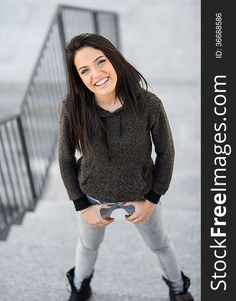 Young woman with green eyes in urban background