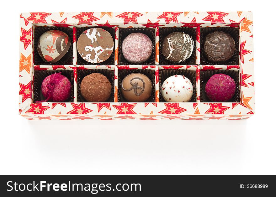 Box of pralines on white background