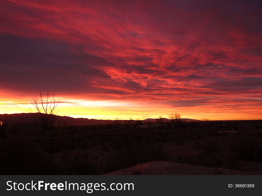 A picture of a bright red and yellow sunrise in New Mexico. A picture of a bright red and yellow sunrise in New Mexico.