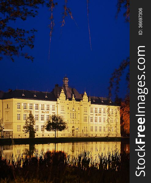 The historic high school building built in 1901, in the reflection surface of a pond, Litovel, Czech Republic. The historic high school building built in 1901, in the reflection surface of a pond, Litovel, Czech Republic.