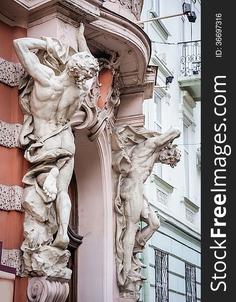 Statues near entrance, architectural details of Lvov Lviv, Ukraine.