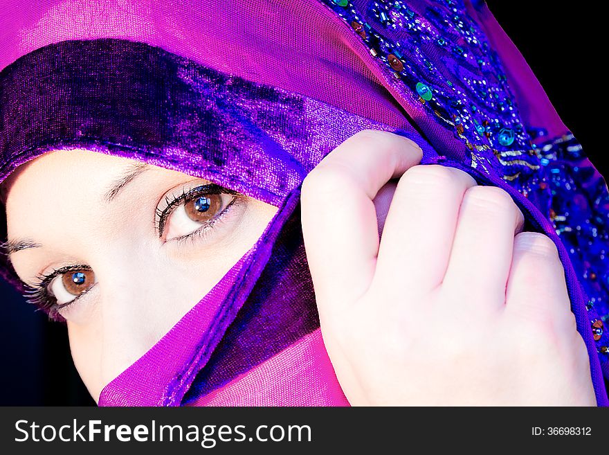 Close-up portrait of a woman with a veil. Close-up portrait of a woman with a veil.