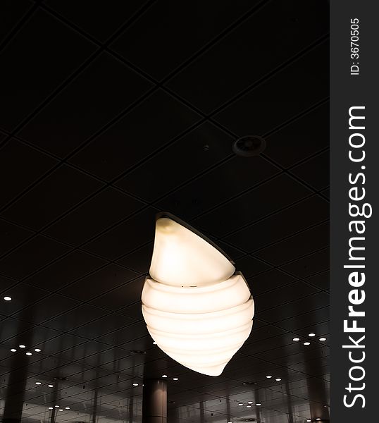 Light fixture on the ceiling of a modern building processed for low key. Light fixture on the ceiling of a modern building processed for low key