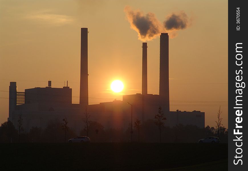 A power station at sunset. A power station at sunset.