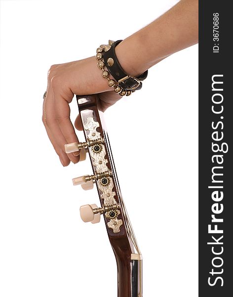 The hand in bracelets holds a guitar