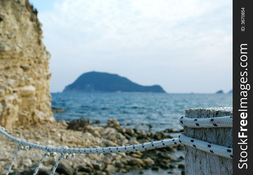 Rope bridge, with island in background. Rope bridge, with island in background