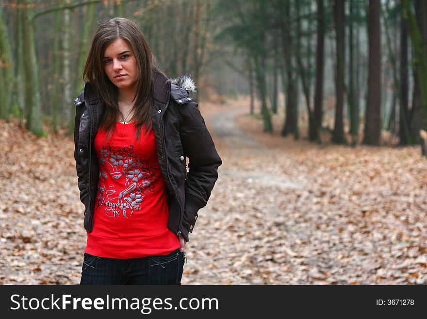 Young girl walking in the forest. Young girl walking in the forest