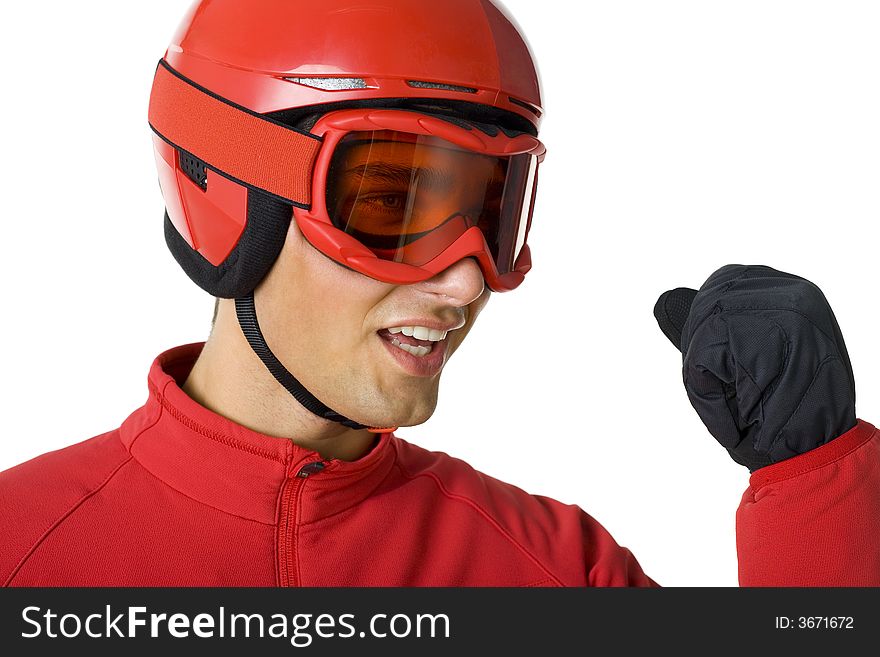 Young skier dressed red ski-clothes with clanched fist. He's on white background. Young skier dressed red ski-clothes with clanched fist. He's on white background.