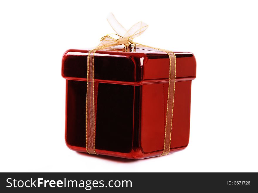 A gift wrapped in yellow and red on a white background