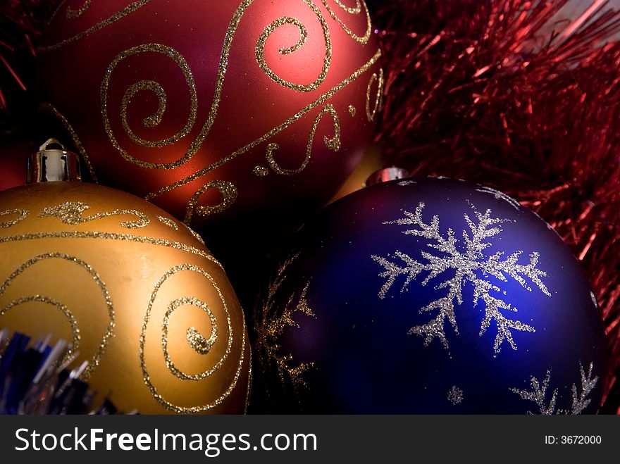 Three colored christmas balls red blue and yellow