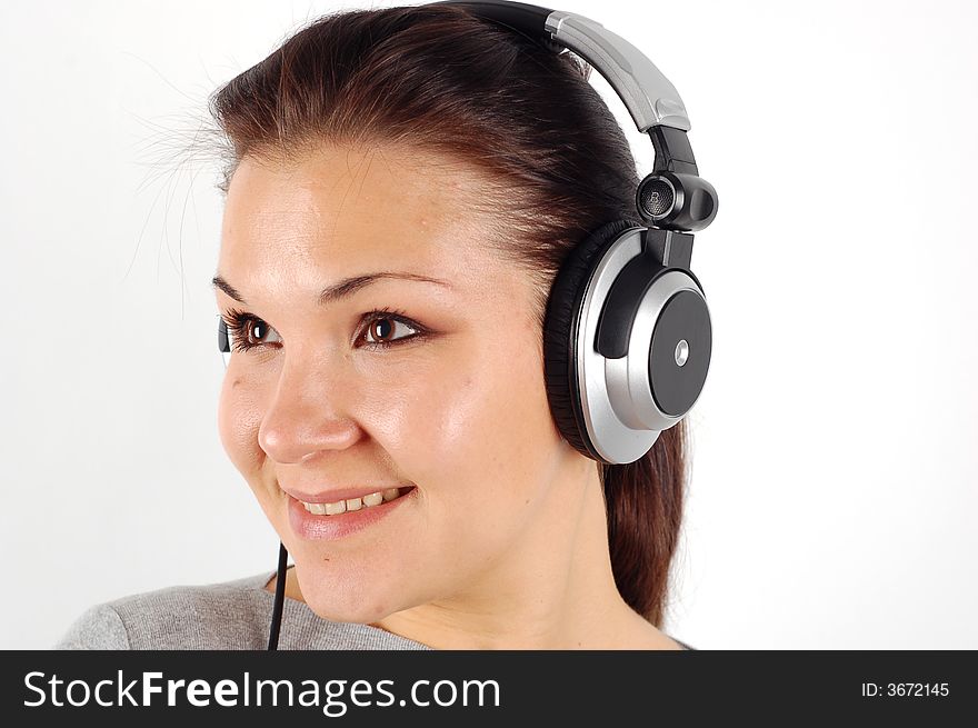 Photo of attractive brunette woman with headphones on white background. Photo of attractive brunette woman with headphones on white background