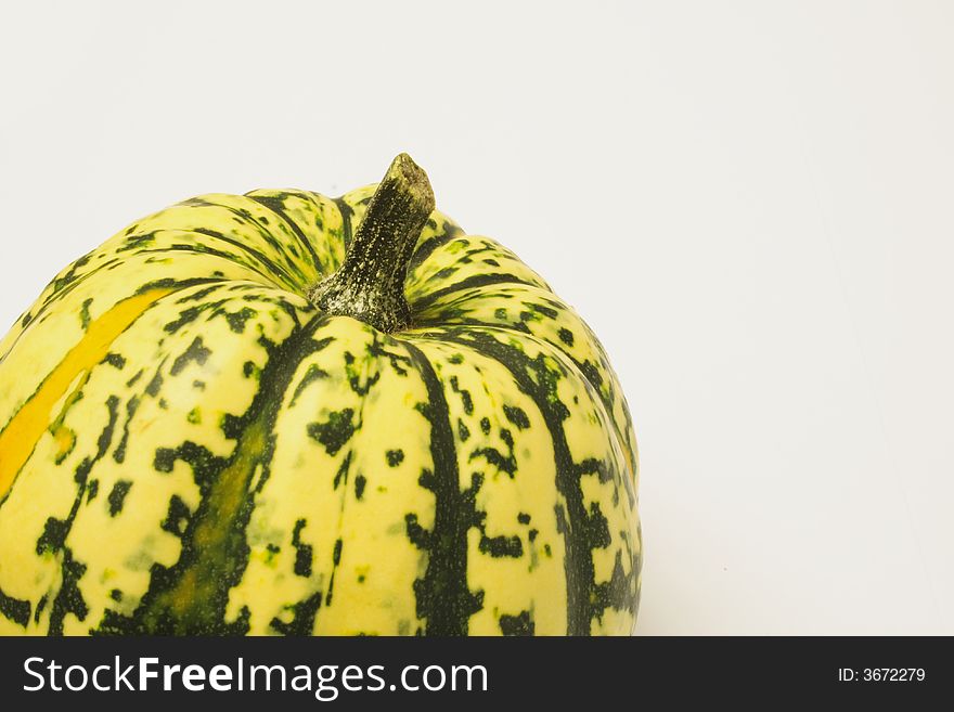 Green and yellow ornamental squash isolated over alight background