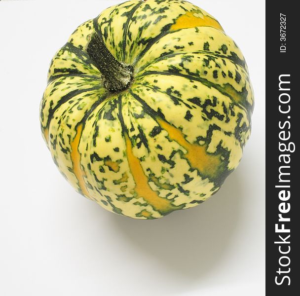 Green and yellow ornamental squash isolated over alight background