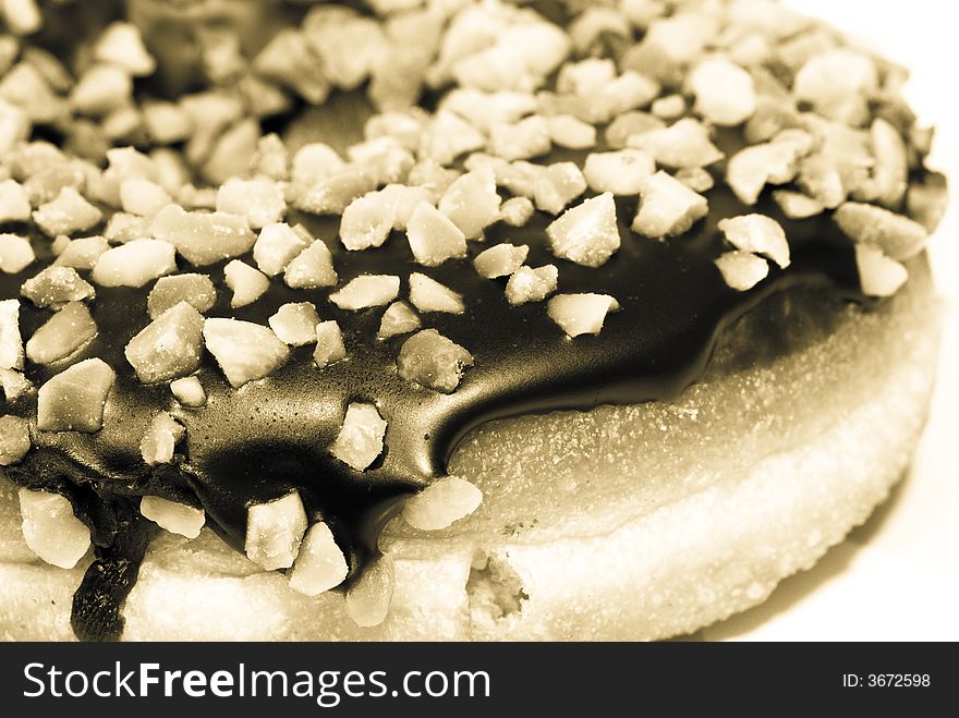 Still life of a chocolate peanut doughnut