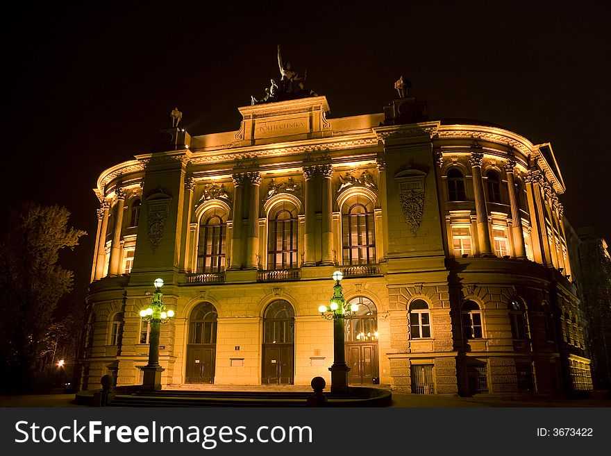 Night scene: awe viwe of Warsaw Politechnika in Poland. 1900 years building illuminated by light