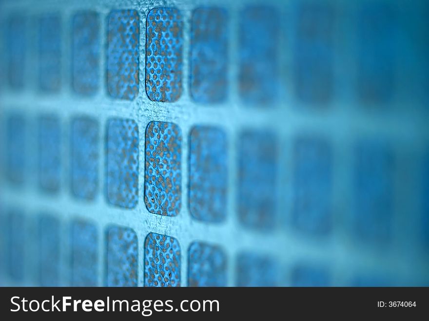 A close up image of a blue and green grid. A close up image of a blue and green grid