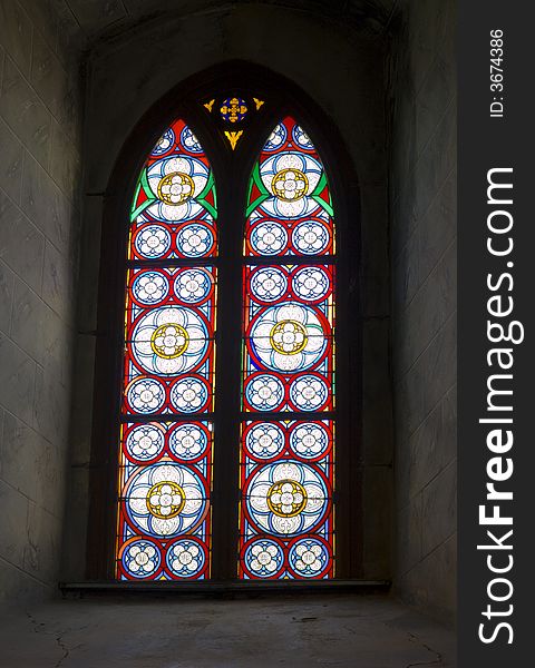 Stained glass of church window in a old chapel. Stained glass of church window in a old chapel.