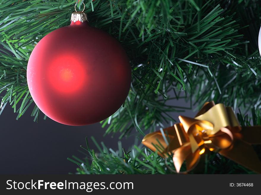 Red Ball Hanging From Christmas Tree