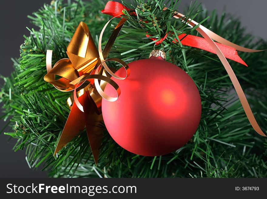Red ball hanging from christmas tree