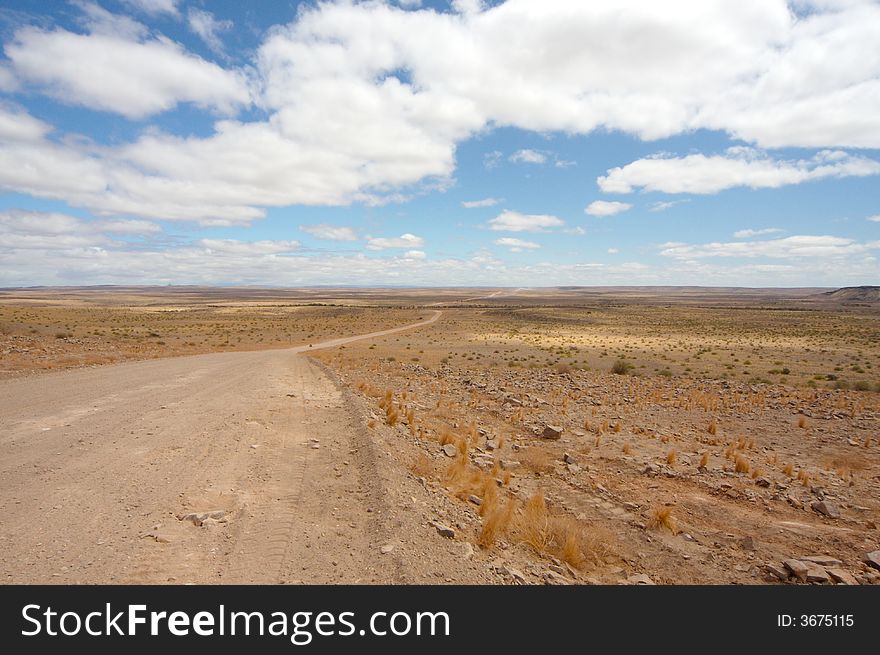 Endless gravel road into the desert. Endless gravel road into the desert