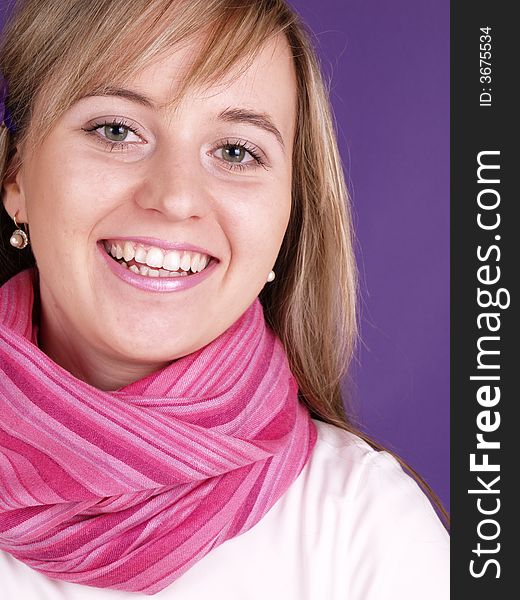 Smiling girl on the purple background