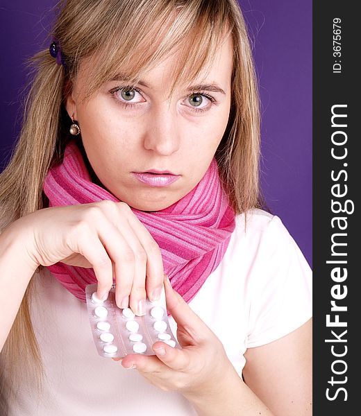 Portrait of  beautiful woman with tablets on her hand