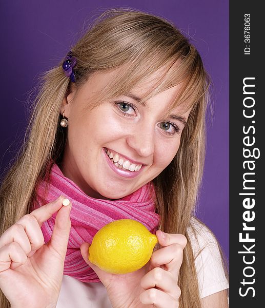 Young woman with lemon in hand