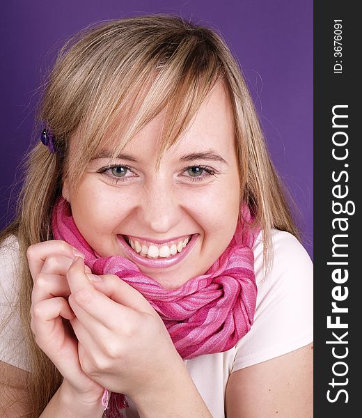 Smiling beautiful girl with pink scarf