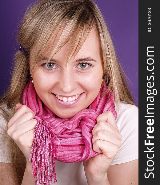 Beautiful girl holding pink scarf