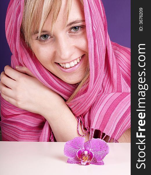 Beautiful young woman with pink scarf. Beautiful young woman with pink scarf.