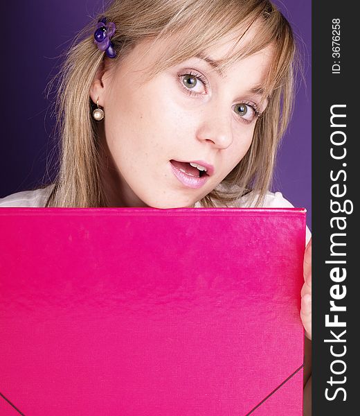 Young woman with pink folder. Young woman with pink folder.