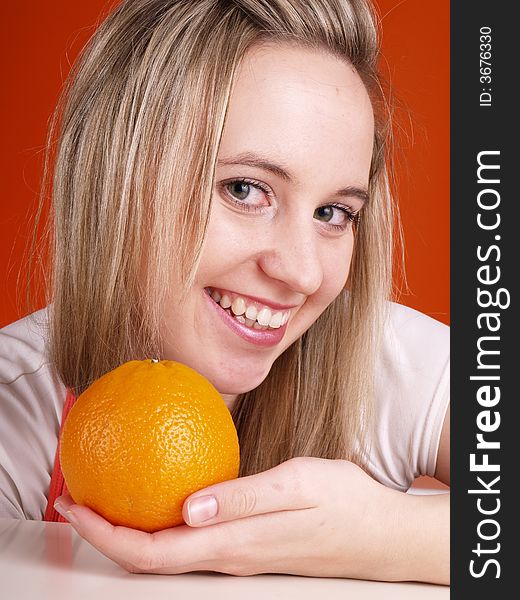 Cute young woman with orange