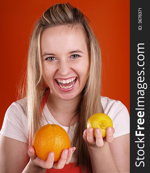Happy woman with orange and lemons. Happy woman with orange and lemons.