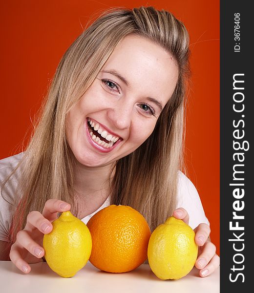 Happy young woman and fruits.