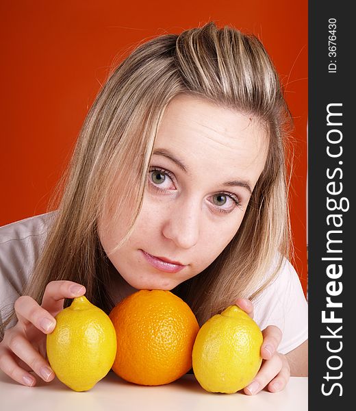 Young blond woman with fruits.