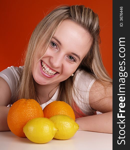 Smiling cute girl with fruits