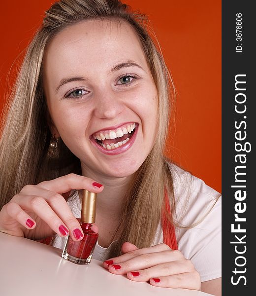 Beautiful girl applying nail polish. Beautiful girl applying nail polish