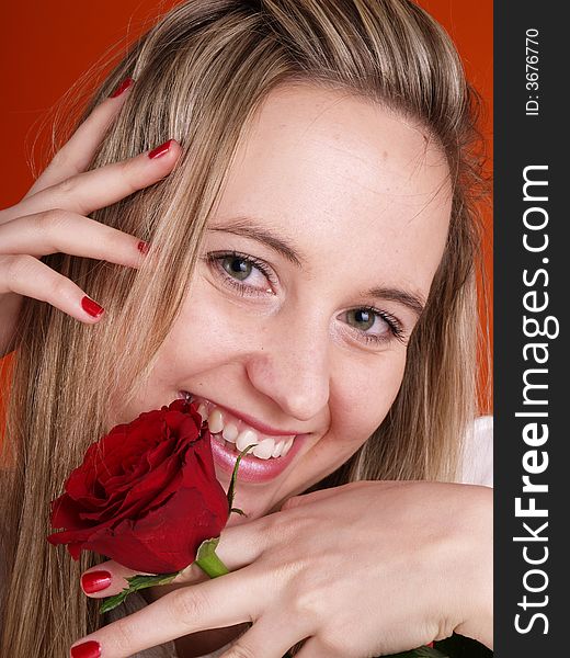 Beautiful girl holding a red rose. Beautiful girl holding a red rose