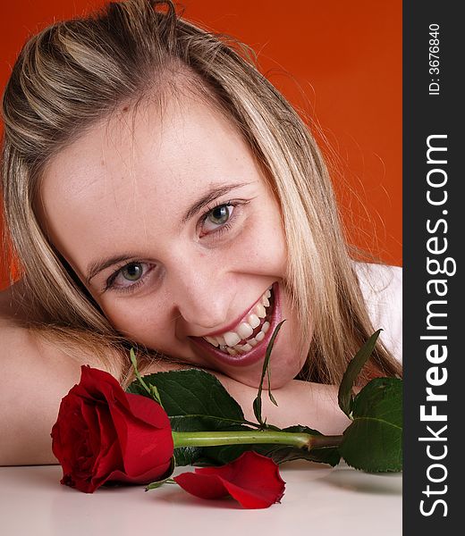 Smilling cute girl with red rose. Smilling cute girl with red rose