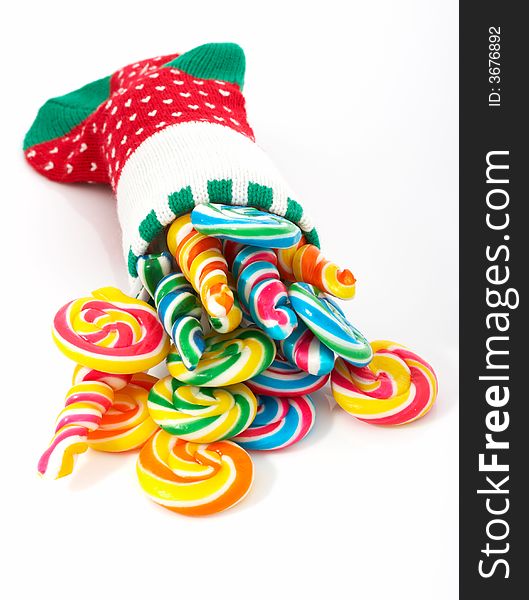 A christmas stocking with lollipop candies inside. A christmas stocking with lollipop candies inside