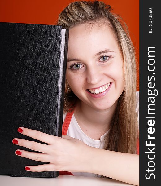 Smiling young woman with black folder. Smiling young woman with black folder.