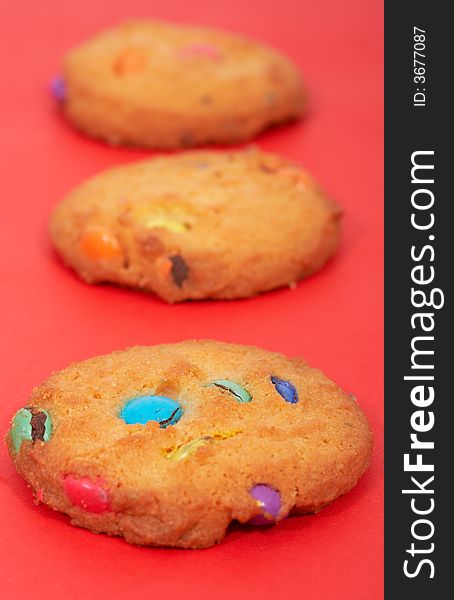 Tasty sweet biscuits over a red background