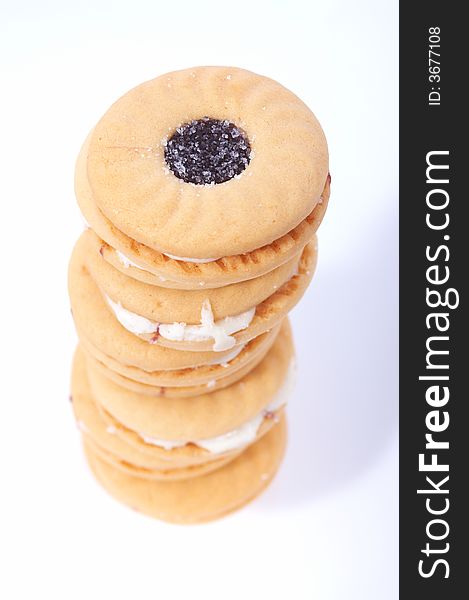 Stack of tasty biscuits over a white background