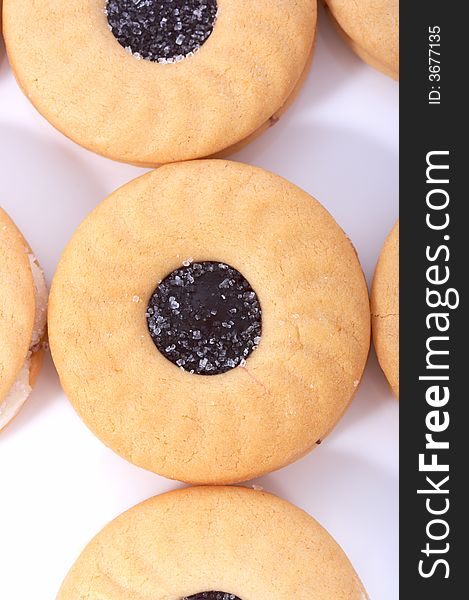 Tasty sweet biscuits over a white background