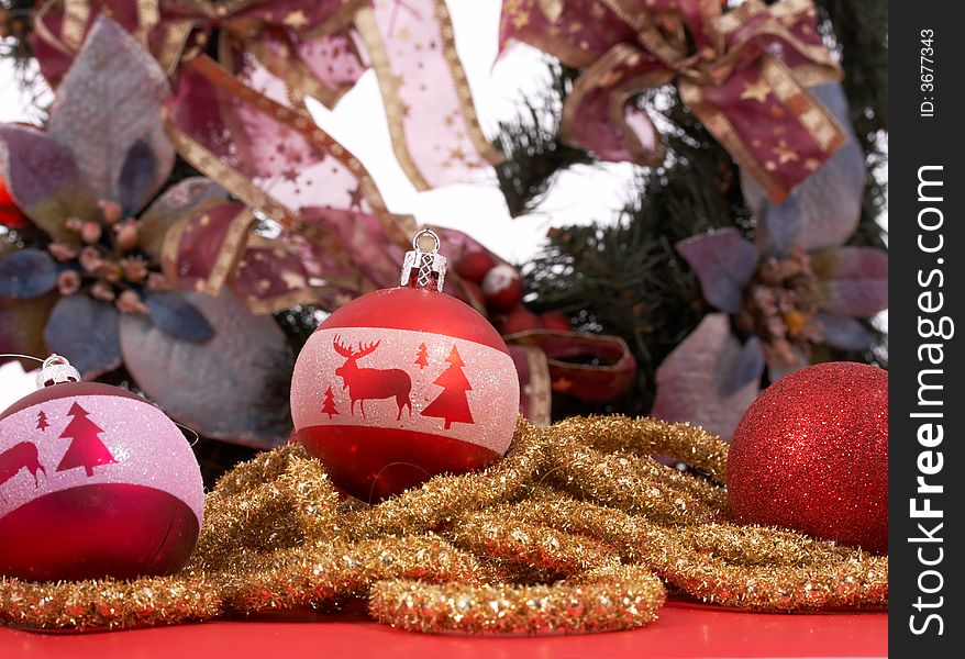 Variety of Christmas decorations over a red and white background